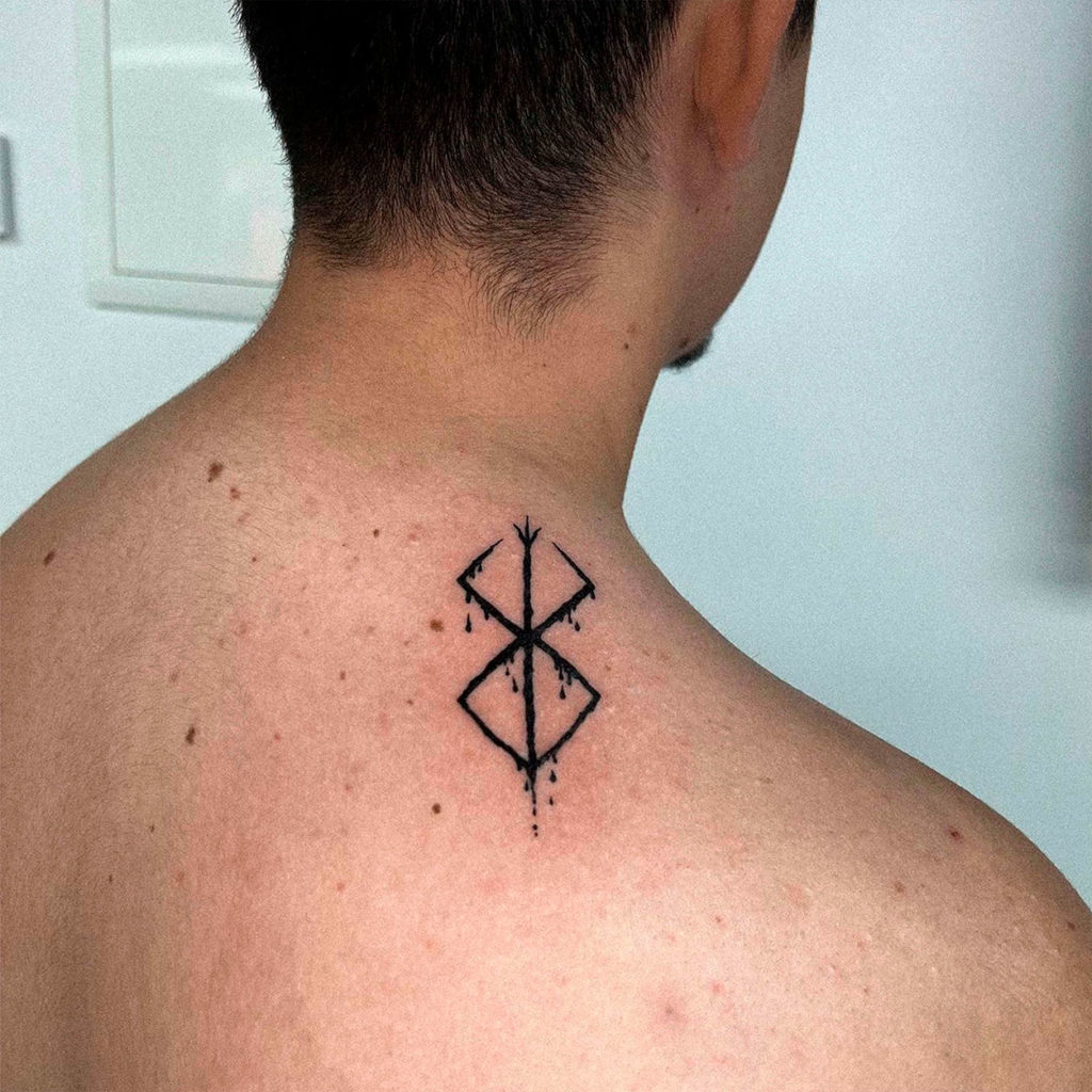 Small tattoo berserk guts symbol neck brand of sacrifice